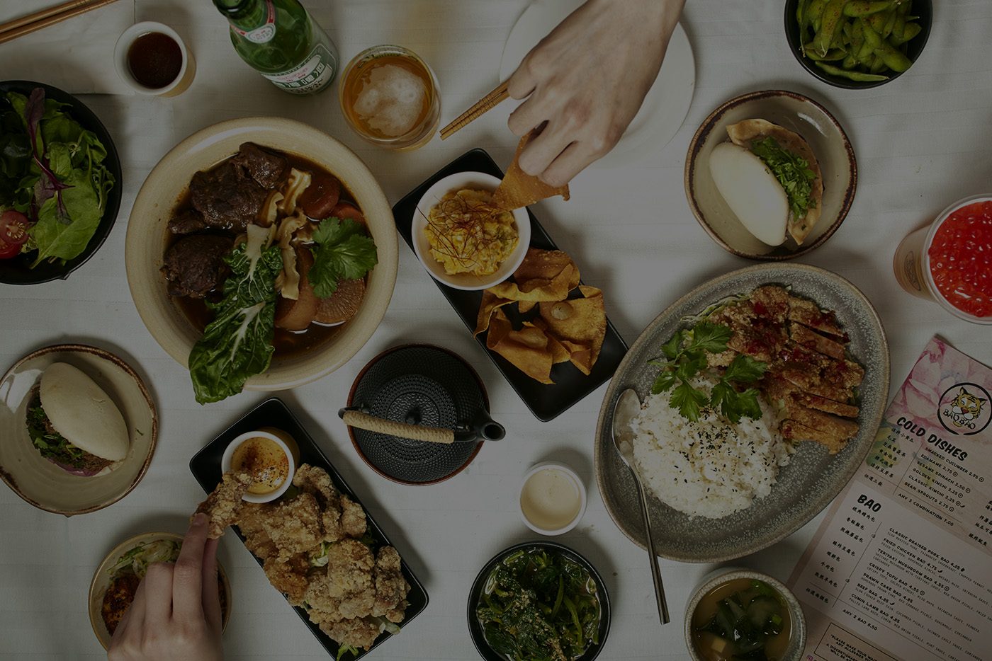 Friends sharing Taiwanese dishes at BaoBao