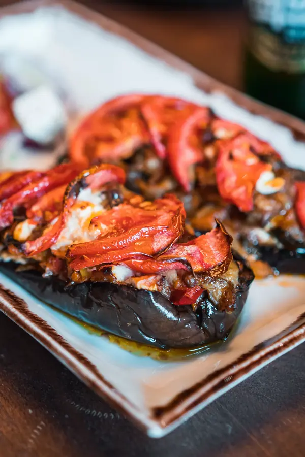 Stuffed aubergine with tomato and feta