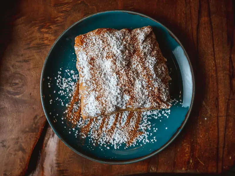 Bougatsa dusted with sugar and cinnamon
