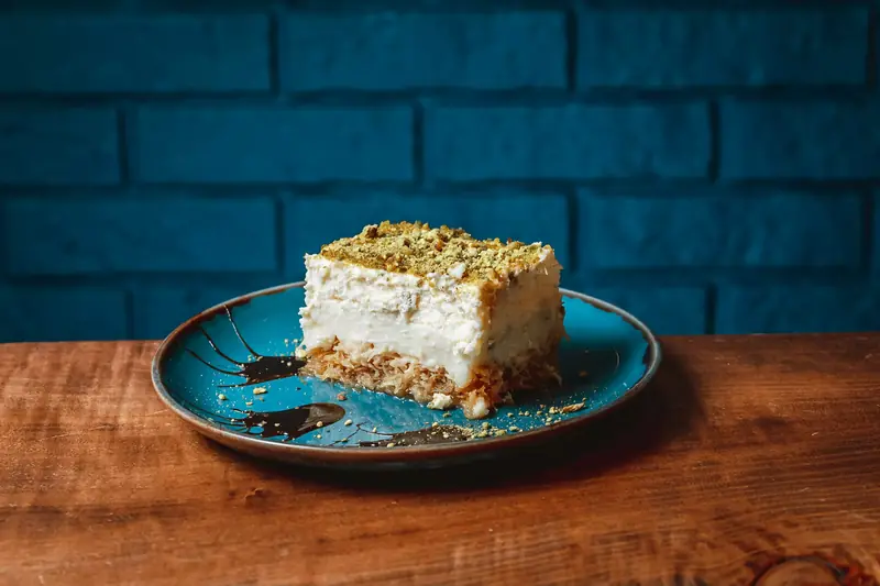 A square of ekmek kataifi topped with pistachio
