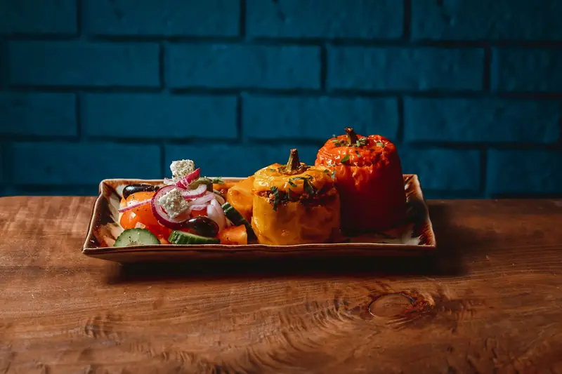 Stuffed peppers and tomatoes on a platter