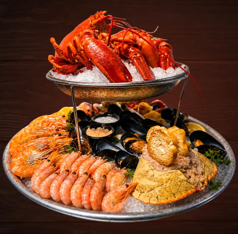The Shell for Two: a two-tier tower with lobsters on top and prawns, mussels and crab below