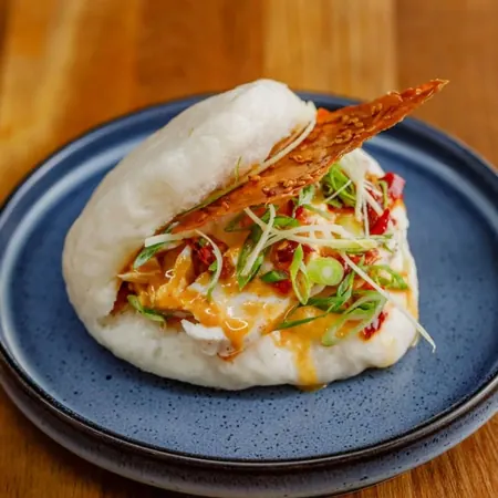 White cut chicken bao with chilli oil and sesame